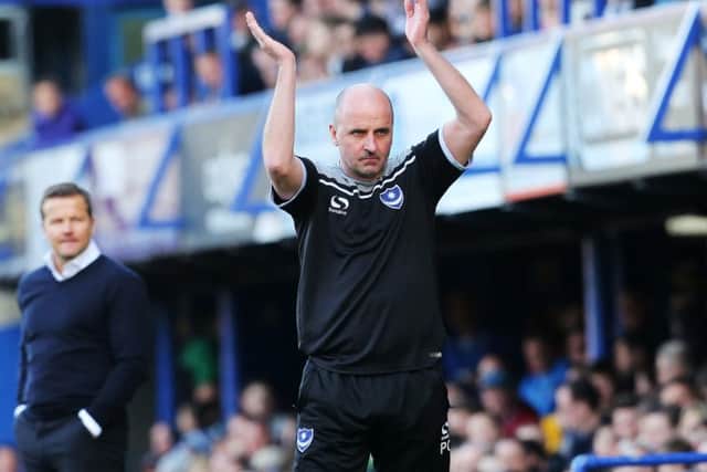 Pompey boss Paul Cook shows his appreciation to the Fratton faithful Picture: Joe Pepler