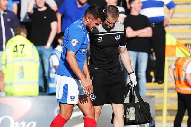 Gareth Evans is helped off the pitch at Home Park Picture: Joe Pepler