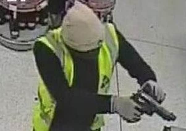CCTV image of robbery in Co-op Clanfield