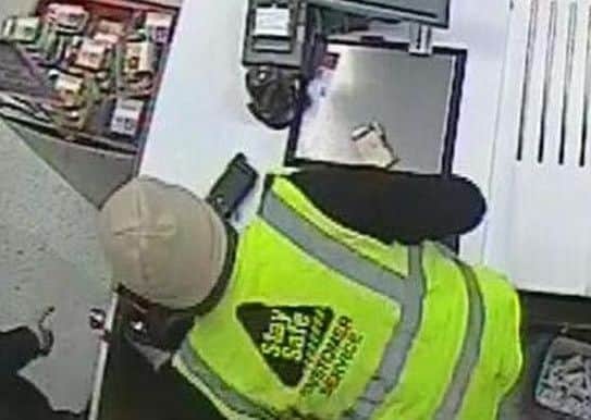 CCTV image of robbery in Co-op Clanfield