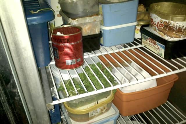 Dirty food containers in a chiller