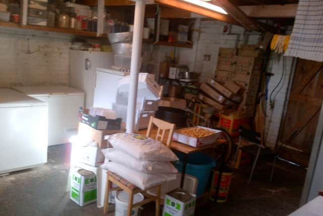 A disorderly store room with high-risk food unprotected