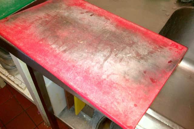 Dirty and scored food preparation board