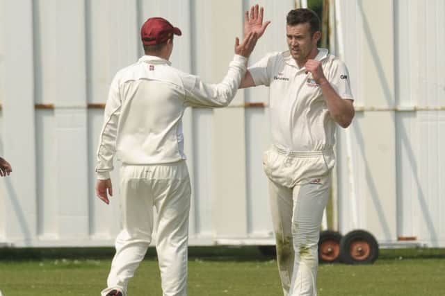 Conor Regan, right, celebrates a wicket as he was the pick of the Gosport Borough attack against Fair Oak Picture: Mick Young