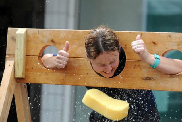 PCSO Amanda Turner gets a soaking as part of the 50th celebrations for Greywell precinct in Leigh Park Picture Ian Hargreaves  (160709-3)