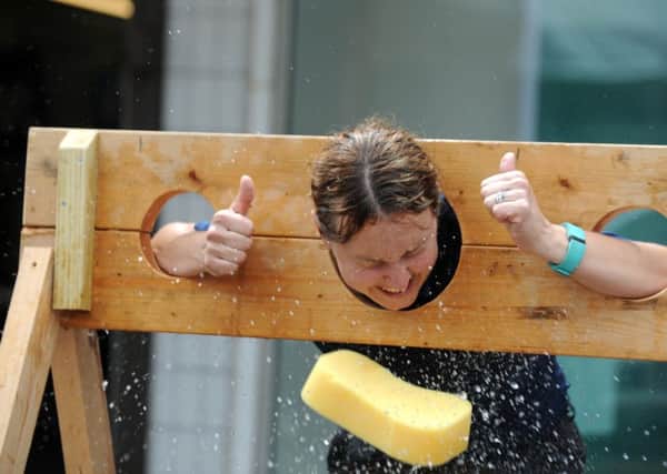 PCSO Amanda Turner gets a soaking as part of the 50th celebrations for Greywell precinct in Leigh Park Picture Ian Hargreaves  (160709-3)