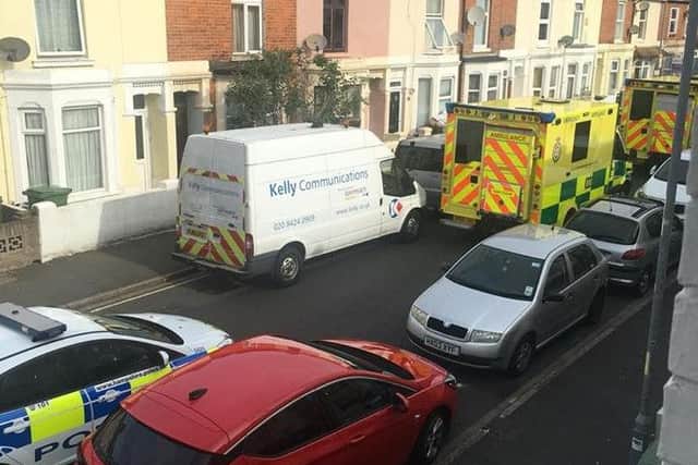 Emergency services in Frogmore Road after a man died