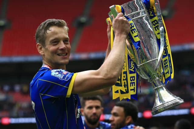 AFC Wimbledon's Paul Robinson with the Sky Bet League Two Trophy