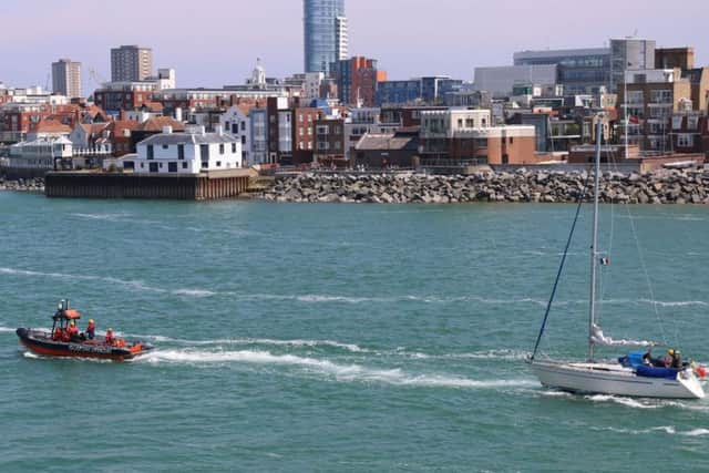 GAFIRS takes a Bavaria yacht under tow into Portsmouth Harbour on Sunday, May 29, 2016 Picture: Beverley Haggard, Gosport NCI