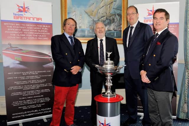 Alan Priddy, second left, from Team Britannia with the Dupree International Challenge Trophy alongside Commodore Miles Linington, Adrian Saunders and Squadron Leader Simon Wright-Cooper, Secretary at the Royal Naval Club & Royal Albert Yacht Club. Photo: Chris Davies/Team Britannia