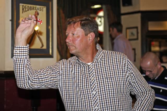Stag As Paul Hooker finished a leg in 14 darts and scored 180 				       Picture: Ian Hargreaves