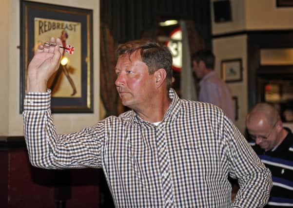 Stag As Paul Hooker finished a leg in 14 darts and scored 180 				       Picture: Ian Hargreaves