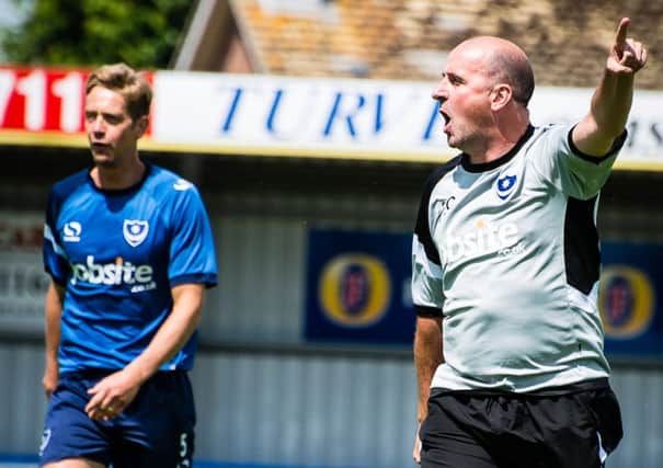 Paul Robinson, left, with Pompey boss Paul Cook during pre-season training last summer Picture: Joe Pepler