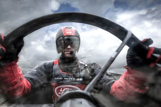 Skipper Sir Ben Ainslie at the helm. Picture: Harry KH / Land Rover BAR