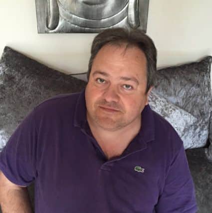 Neil Tidy, 45, of Petersfield, who helped rescue Robert Davies