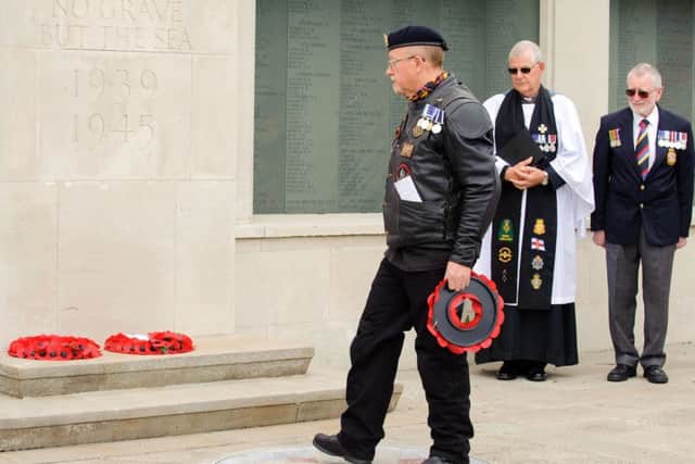 Andy Brown, chairman of the Gosport and Alverstoke branch of the Royal British Legion, lays a wreath 
Picture: Allan Hutchings (160421-026)