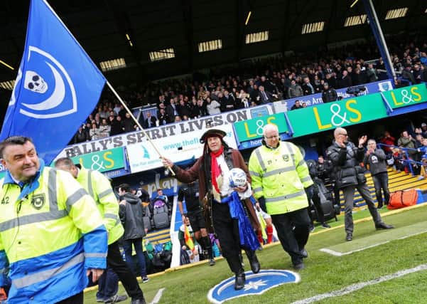 Craig Bryden leads out the Pompey team against Plymouth at Fratton Park in April Picture: Joe Pepler