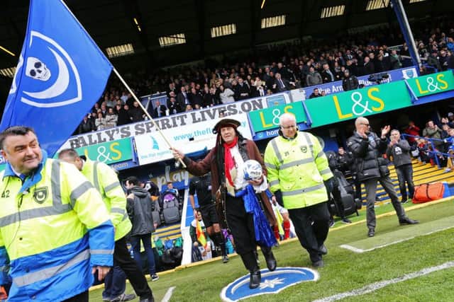 Craig Bryden leads out the Pompey team against Plymouth at Fratton Park in April Picture: Joe Pepler
