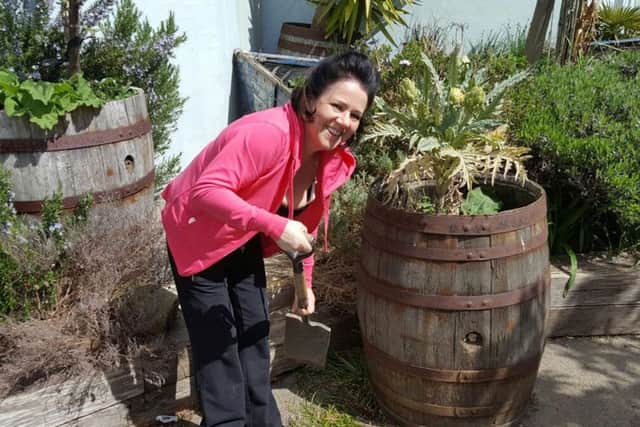 Gayle Reynolds, the business manager  of the McDonalds restaurant in Commercial Road, Portsmouth, helping at the playground