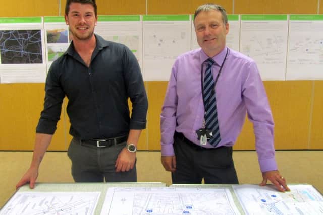 (L-r) Alex Hawkins (project engineer for Havant Borough Council) and Stuart Wood (civil engineering and landscape manager for Havant Borough Council) with the plans    Picture: Jack Boulton