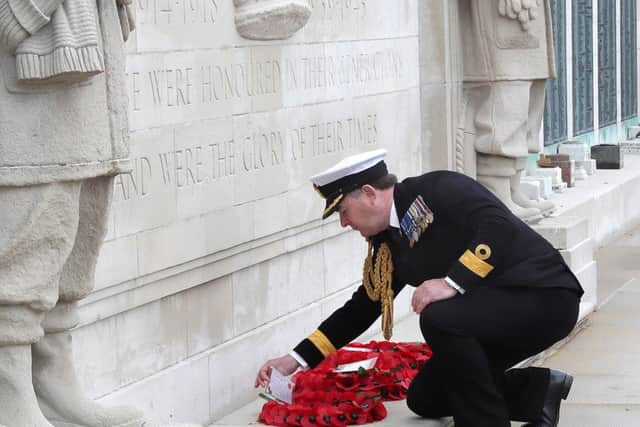 Commodore Jeremy Rigby, Portsmouth Naval Base commander, lays a wreath at the war memorial on Southsea Common
