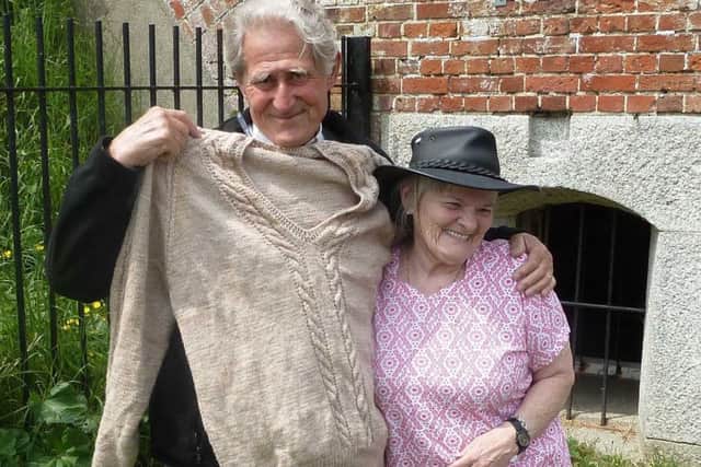Joseph Dusty Miller  with Red Hat Knitter Hunny Helen-Ann Wilson-Reid , who helped to finish off a jumper that his late wife had been knitting for him