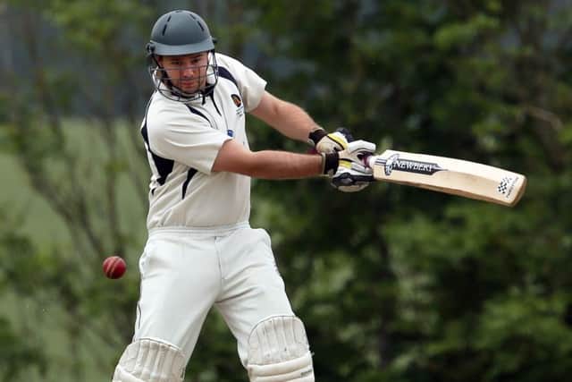 Will Bond hits a boundary for Hambledon. Picture: Innes Marlow
