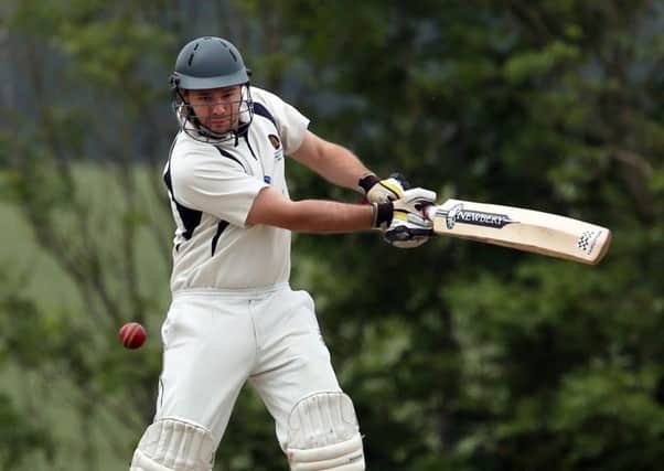 Will Bond hits a boundary for Hambledon. Picture: Innes Marlow