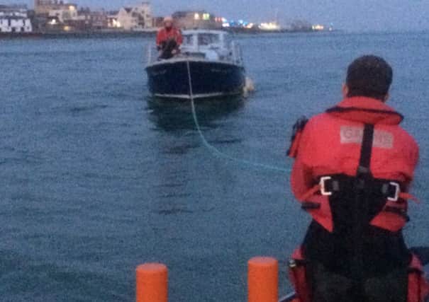 Rescuers grom Gafirs towed a broken down vessel away from a busy shipping lane in The Solent on Sunday evening