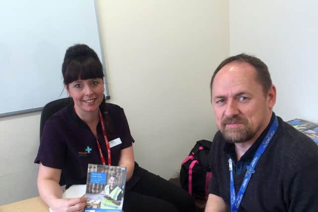 Richard Kelly, systems manager at Portsmouth International Port has a health check with Pamela MacPherson from Rowlands Pharmacy