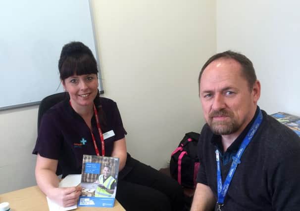 Richard Kelly, systems manager at Portsmouth International Port has a health check with Pamela MacPherson from Rowlands Pharmacy