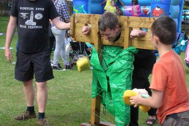 The Rev Paul Armstead in the stocks at last year's fete