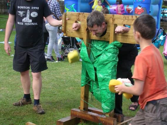 The Rev Paul Armstead in the stocks at last year's fete