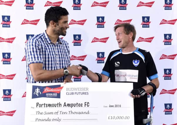 David James, presents a cheque for Â£10,000 to Portsmouth Amputees striker and Budweiser Dream Goal runner-up Ray 'Spike' Westbrook