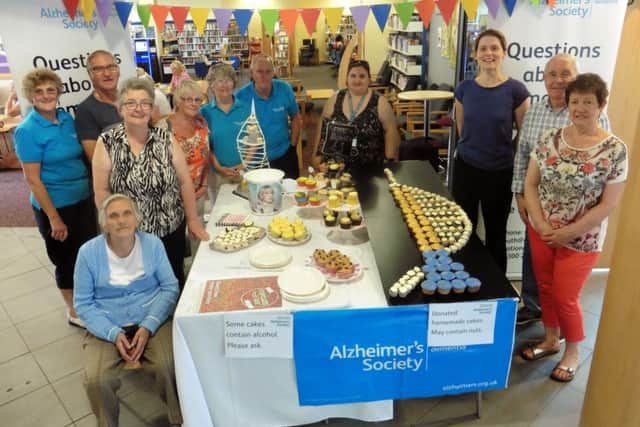 Members of Portsmouth's Alzheimer's Society recreate the iconic Spinnaker Tower in cake-form for the first annual Cupcake Day
