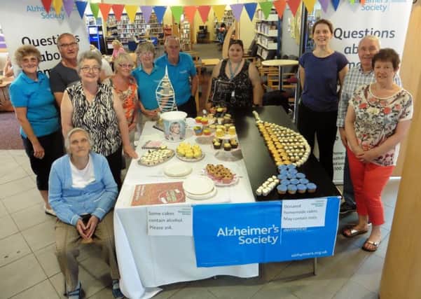 Members of Portsmouth's Alzheimer's Society recreate the iconic Spinnaker Tower in cake-form for the first annual Cupcake Day
