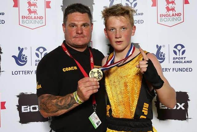 Titchfield Boxing Clubs Tommy Maggs, right, with coach Tim Henderson after winning the English Schools Championship title