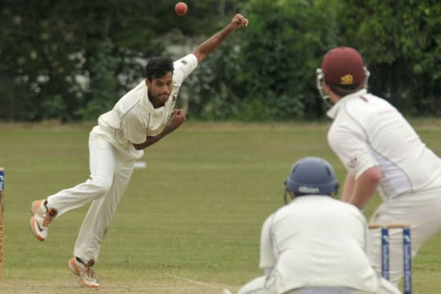 Star man Sunny Bhimsaria bowls for Bishop's Waltham at Fareham & Crofton. Picture: Mick Young (160759-02)