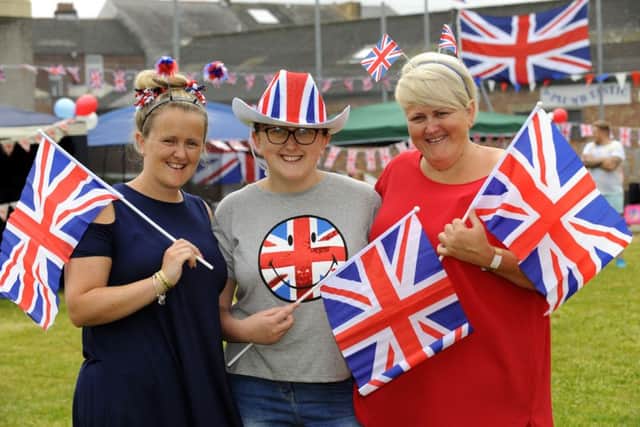 Residents of King Albert Court in King Albert Street, Portsmouth enjoyed a party in the square between the housing blocks on Sunday for the Queens birthday. Pictured are organisers Chantelle Ash, 30, left, and her sister Lisa Ash 39, right, with Lakeesha Ash, 16, in the centre                              Picture: Malcolm Wells (160612-8155)