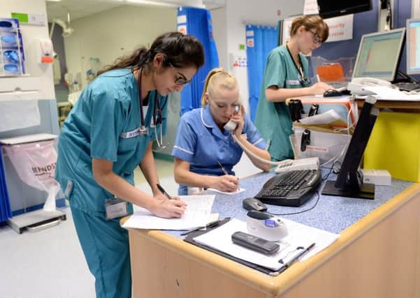Doctors and nurses at work in A&E