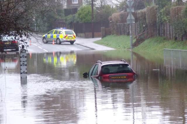 A car submerged in floodwater
