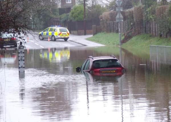 A car submerged in floodwater