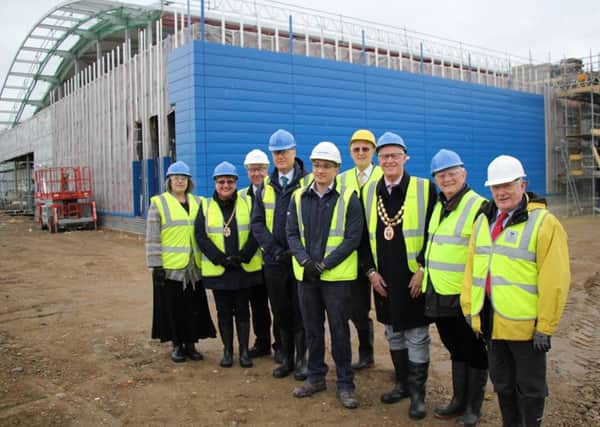 From left, Cllr Sue Bell, mayoress of Fareham Anne Ford, Cllr Trevor Cartwright, Cllr Sean Woodward, Jon Chew from Balfour Beatty, Cllr David Swanbrow, Mayor of Fareham Cllr Mike Ford, Cllr Brian Bayford and Cllr Roger Price pictured at the leisure centre in March