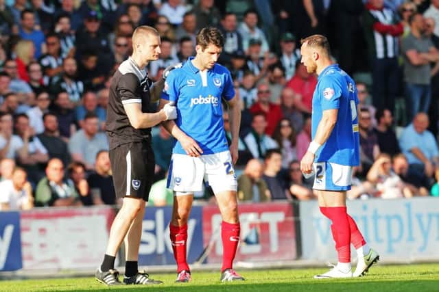 Danny Hollands is forced to leave the field due to an ankle injury at Plymouth