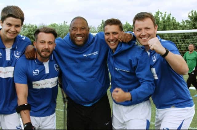 Former England star John Barnes with players from Portsmouth Amputee FC. From left, Michael Beel, Roger Whitehouse, John Barnes, Gary Marheineke and Mike Gays