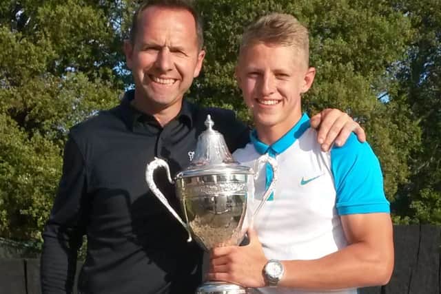 Stanley Garland, right, celebrates after regaining his Gosport & Stokes Bay Golf Club Championship title with dad Pete Garland