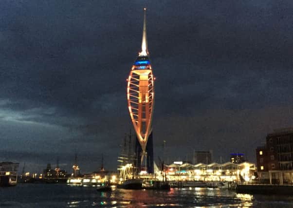 The Spinnaker Tower is illuminated on a cycle of red, blue, green and yellow tonight as a tribute to those killed in the Orlando Pulse nightclub
