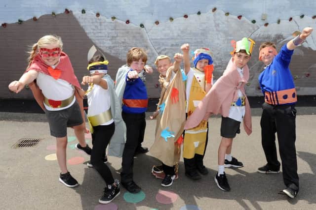 From left, Millie Ponsford, nine, Romina Abbasi, nine, Stanley Lancaster, 10, Rhys Baker, 10, Pavels Nikitin, 10, Ronnie Hale, nine, and Alfie Hammacott, 10, at Arundel Court Primary School Picture: Sarah Standing (160824-2100)