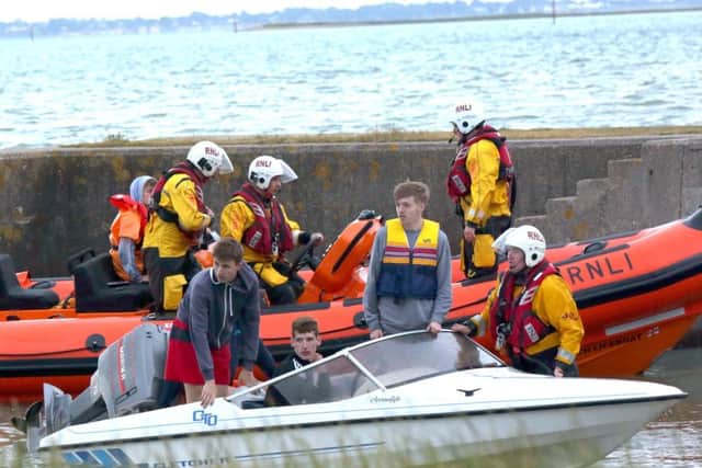 The boat being towed to shore Picture: Jason Kay/UKNIP