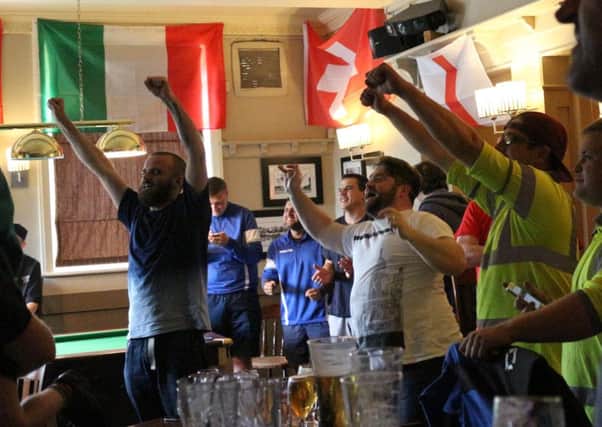 England fans at the Coach & Horses in Hilsea celebrate Daniel Sturridge's injury-time winner Picture: Emma Rossiter